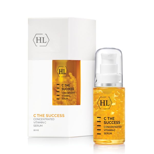 Concentrated vitamin C serum bottle with pump and boxed label, amber liquid