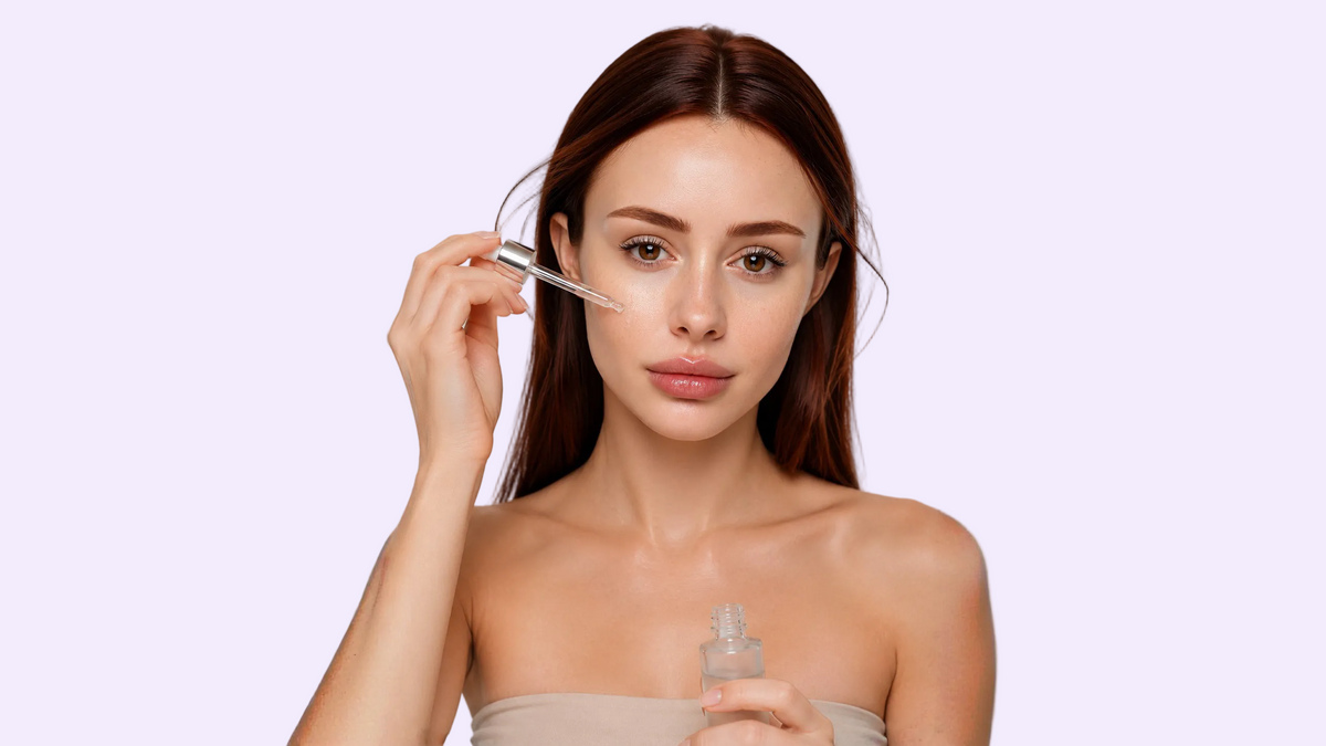 Woman applying facial serum
