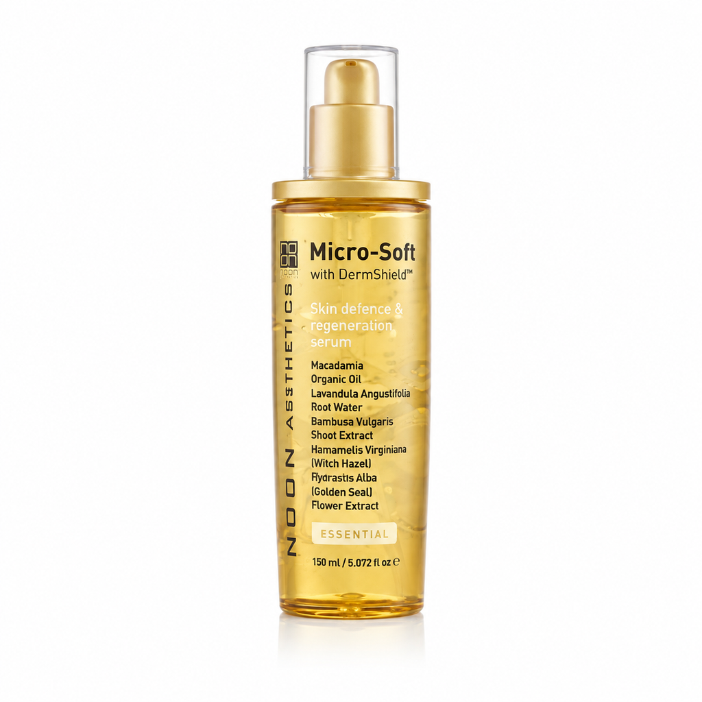 Micro-soft skincare serum bottle with gold pump and amber liquid