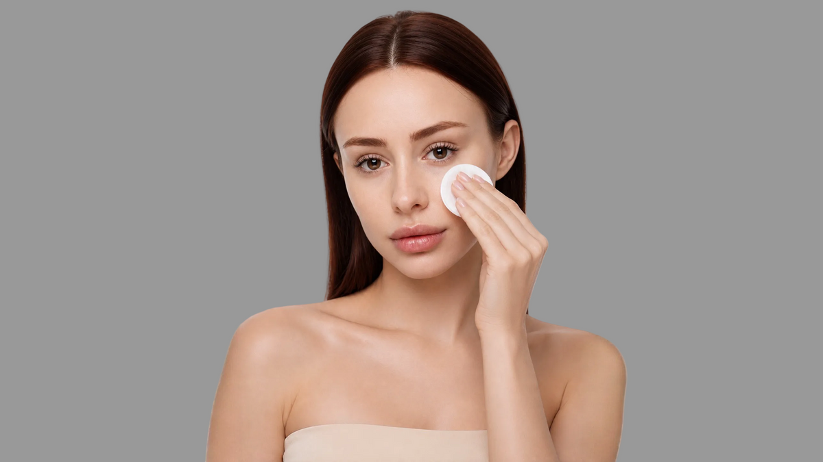 Woman applying facial toner
