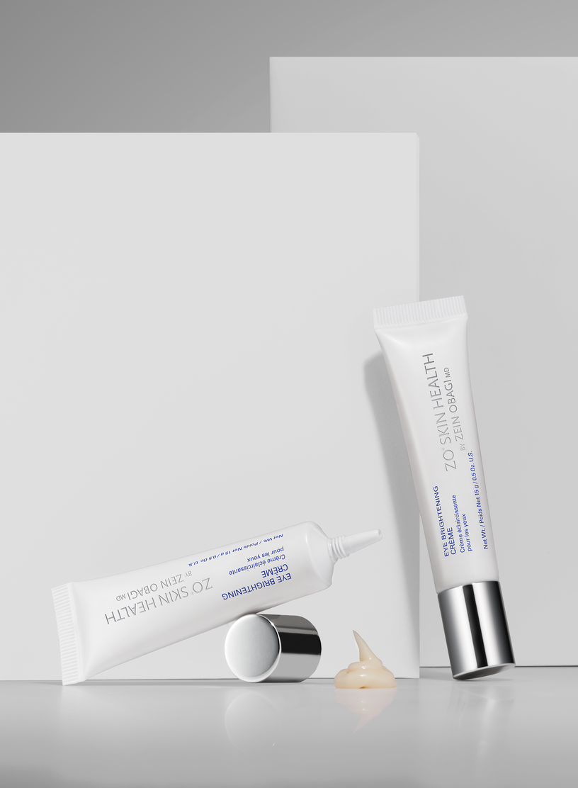 Two skincare tubes on a light gray background