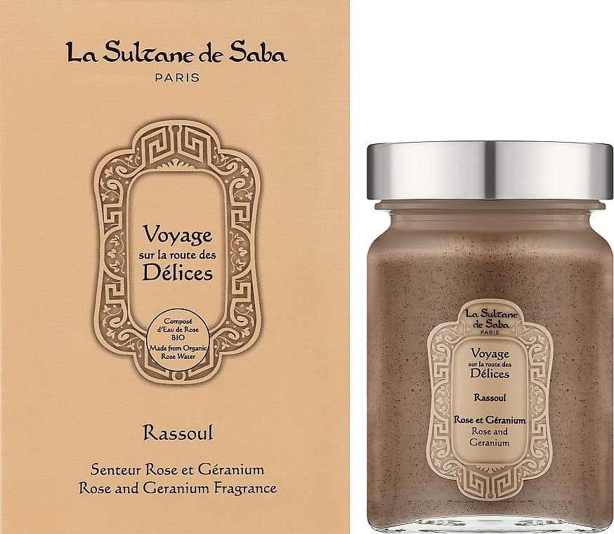 La Sultane de Saba 'Voyage sur la route des Délices' Rose and Geranium fragrance, shown with its beige packaging box on the left and the glass jar with a silver lid on the right. Rassoul Face, Body & Hair Mask
