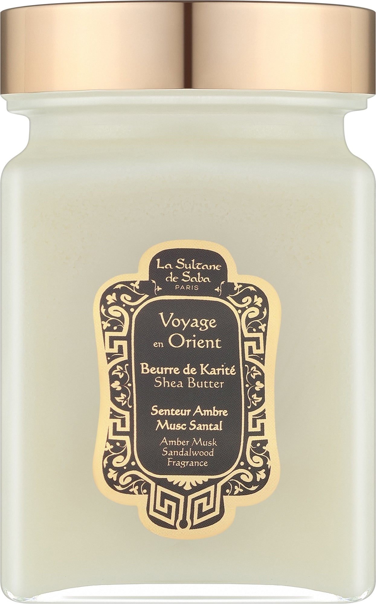 A glass jar candle with a metallic rose gold lid and a central black and gold label reading 'Voyage en Orient' by La Sultane de Salo.